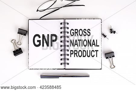 Notebook With Gnp Gross National Product On Table