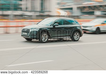 Moscow, Russia - May 2021: Front Side View Of Audi Q5 Suv In Motion. Black 4x4 Car Moving On The Str