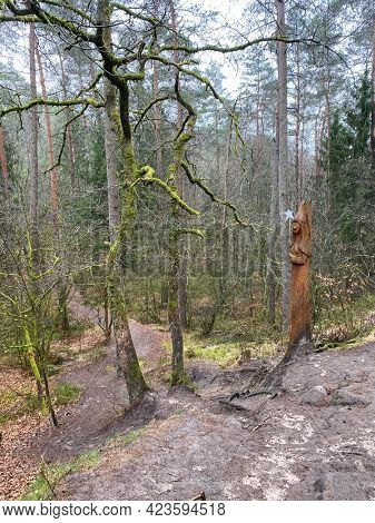 Wooden Sculpture of a fairy at the edge of the fairy path in Virton, Luxembourg, Belgium