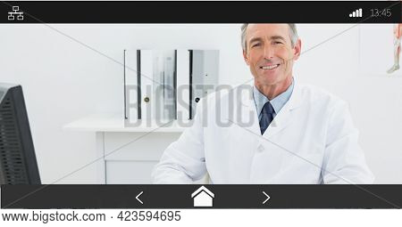 Composition of male doctor smiling on digital image interface screen. medical and healthcare services communication digital interface concept digitally generated image.