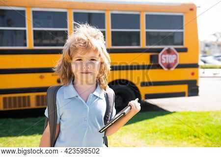 Back To School. Happy Child Near School Bus. Cute School Boy Potrait.