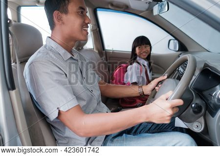 Dad Taking Her Daughter To School In The Morning By Driving A Car