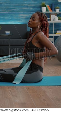 Athetic Black Woman In Sportswear Watching Aerobic Online Sport Workout On Laptop Working Body Muscl