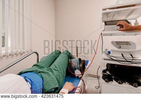 Physical Electrical Therapy Reatment Of Female Patient After Injury