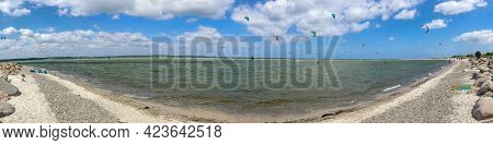 Panorama Of Kite Surfing Activity At The Baltic Sea Beach Of Laboe In Germany On A Sunny Day
