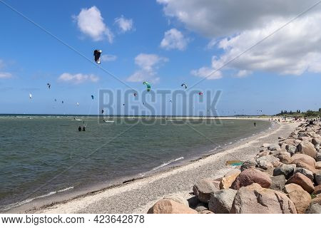 Lots Of Kite Surfing Activity At The Baltic Sea Beach Of Laboe In Germany On A Sunny Day