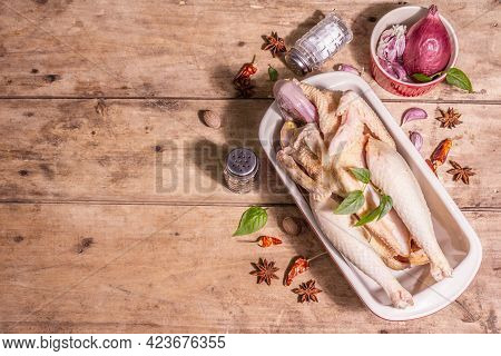Raw Whole Chicken Carcass For Healthy Food Lifestyle With Traditional Chinese Spices In Ceramic Baki