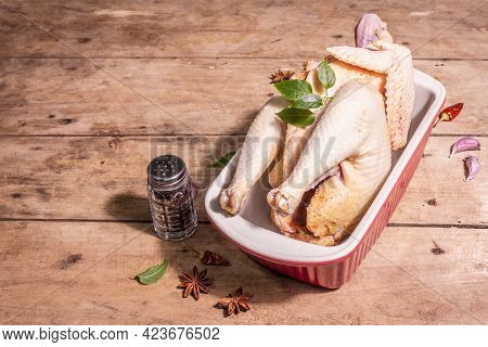 Raw Whole Chicken Carcass For Healthy Food Lifestyle With Traditional Chinese Spices In Ceramic Baki