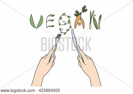 Vegan Food And Dieting Concept. Human Hands Forming Word Began Out Of Cutlery And Raw Natural Vegeta