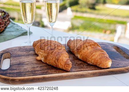 Breakfast With Fresh Baked Croissants And  Brut Champagne Sparkling Wine In Flute Glasses Served On