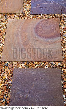 Top-down View Of Part Of A Patio Of Indian Sandstone With Gravel Inlays