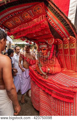 Payyanur, India - December 5, 2019: Theyyam artist perform during temple festival in Payyanur, Kerala, India. Theyyam is a popular ritual form of worship in Kerala, India