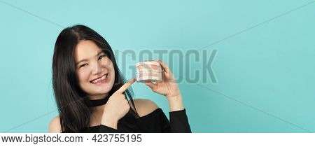 Woman Holding Toothbrush And Dental Teeth Model. Oral Health Care Concept.