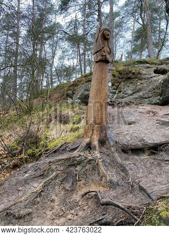 Wooden Sculpture of a fairy at the edge of the fairy path in Virton, Luxembourg, Belgium