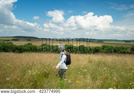 Beautiful Scenic Landscape With Young Girl Tourist, Walking In Meadow And Watching Wildlife In Russi