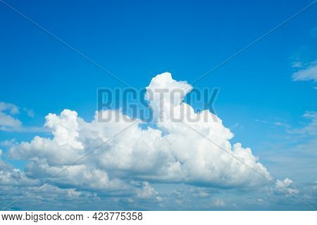 Picture Of Fluffy White Cloud On Blue Sky With Copyspace.