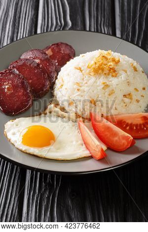 Garlic Rice Served With Fried Egg And Jerky Close-up In A Plate On The Table. Vertical