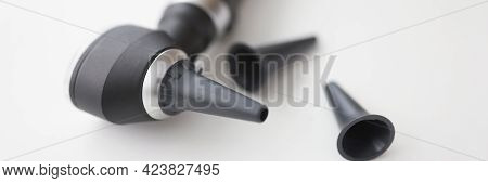 Closeup Of Otorhinolaryngologist Otoscope Tool On White Background