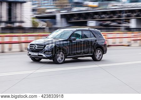 Moscow , Russia - May 2021: Side View Rolling Shot With Black Car In Motion. Mercedes Gle 400 Crosso