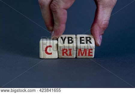 Cyber Crime Symbol. Businessman Turns Wooden Cubes With Words 'cyber Crime'. Beautiful Grey Backgrou