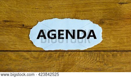 Agenda And Business Symbol. The Concept Word 'agenda' On The Piece Of White Paper. Beautiful Wooden 