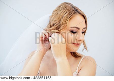 Blonde Girl In A Wedding Dress Bride In A White Dress. Makeup.