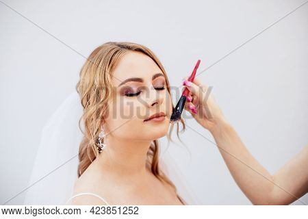 Blonde Girl In A Wedding Dress Bride In A White Dress. Makeup.