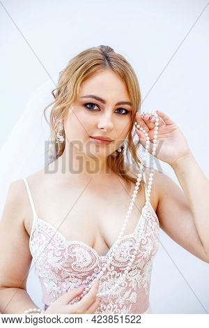 Blonde Girl In A Wedding Dress Bride In A White Dress. Makeup.