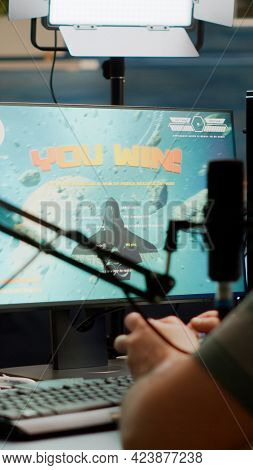 Entusiastic Man Gamer Streamer Wining Space Shooter Video Games Holding Joystick Playing On Professi