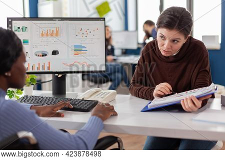 Businesswomen Planning Financial Strategy Looking On Computer Working Together In Start Up Company O