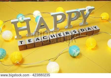 Happy Teachers Day Alphabet Letter With Led Cotton Balls On Yellow Background