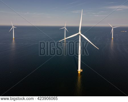 Wind Turbine From An Aerial View, Drone View At Windpark A Windmill Farm In The Lake Ijsselmeer The 