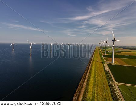 Wind Turbine From An Aerial View, Drone View At Windpark A Windmill Farm In The Lake Ijsselmeer The 