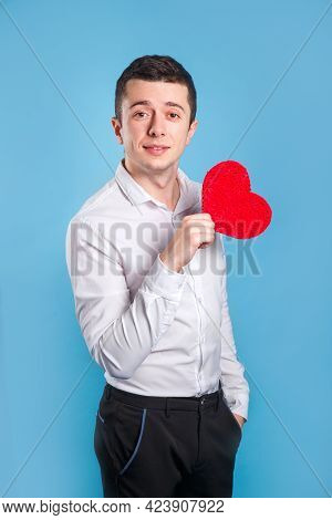 Cute Handsome Man Holdiing Red Heart Made Of Paper For Valentines Day On Blue Background