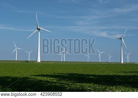 Wind Turbine From An Aerial View, Drone View At Windpark A Windmill Farm In The Lake Ijsselmeer The 