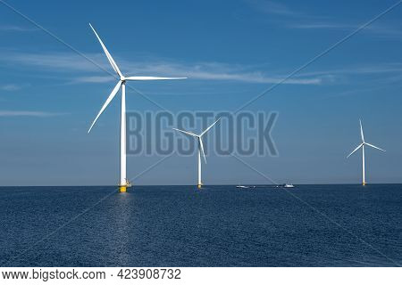 Wind Turbine From An Aerial View, Drone View At Windpark A Windmill Farm In The Lake Ijsselmeer The 