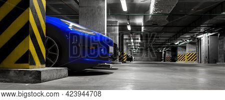Dark Scenic Car Park Underground Multilevel Garage Interior. Concrete Cement Column Covered Building