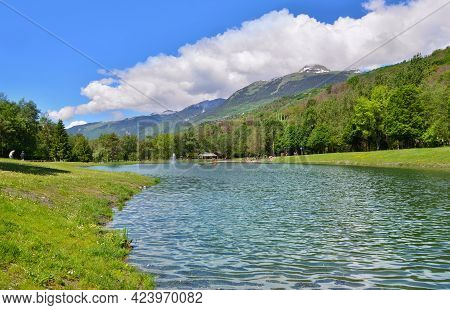 Beautiful View Of A Lake In A Leisure Park Of The Valley Of The Tarentaise In The French Alps