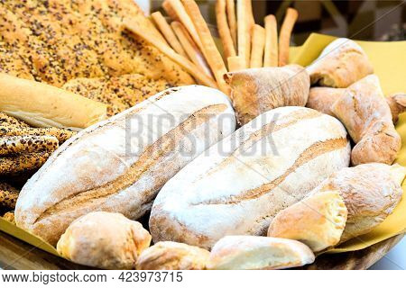 Two Loafs Of Fresh Bread With Other Bakery. Various Types Of Wheat Bakery In Sunday Market. Nutritio