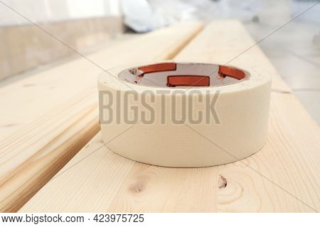 The Concept Of Self-repair. Masking Tape Lies On A Board Prepared For Repair, Close-up