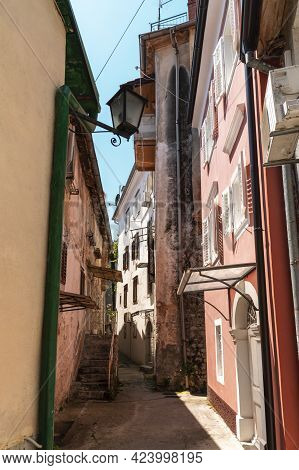 Narrow Street Of Ancient Lovran Town On Adriatic Coast, Croatia.