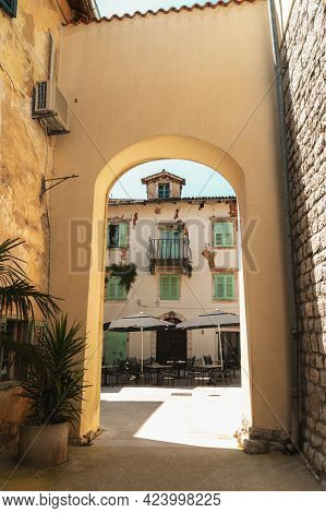 Narrow Street Of Ancient Old Town With Arc, Lovran, Croatia.