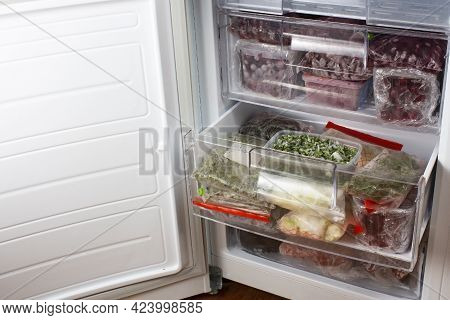 Open Freezer With Frozen Red Cherries And Frozen Vegetables. Food Storage. Deep-frozen Food. Food Su