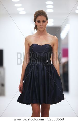 ZAGREB, CROATIA - OCTOBER 12: Fashion model in cocktail dress made by Lorien on 'Wedding Expo' show in the Westgate Shopping City in Zagreb, Croatia on October 12, 2013