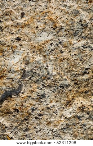 Stone Background of mottled granite igneous rock