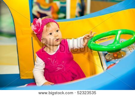 Happy Baby Girl  Keep On Board Ship On Playground  The Concept Of Childhood And Holiday