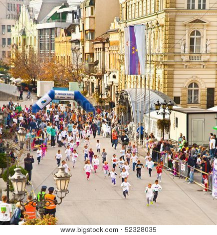 NOVI SAD, SERBIA - OCTOBER 13: Unidentified runners on the street during Novi Sad autumn Marathon on October 13, 2013 in Novi Sad, Serbia