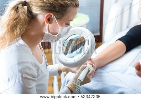 Woman receiving podiatry treatment in Day Spa