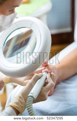 Woman receiving podiatry treatment in Day Spa