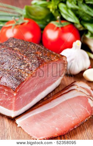 Italian speck on a wooden table